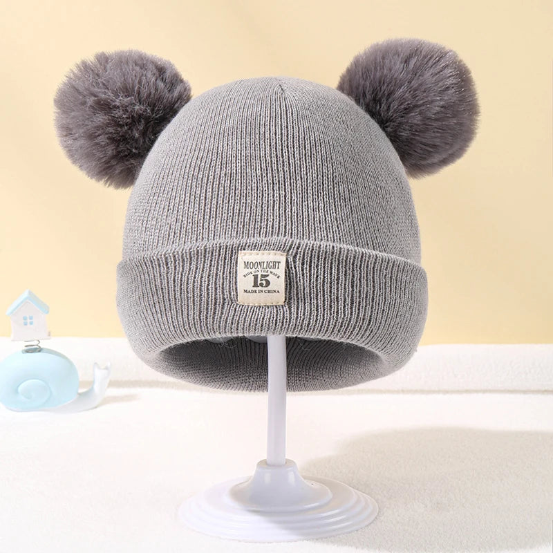 Baby wintermuts – gebreide beanie met pompon – unisex